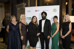 nasen awards - some of the sponsors and trustees pose for a photo in front of the award signage