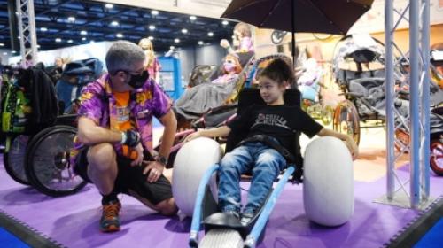 A child on a specialist wheelchair